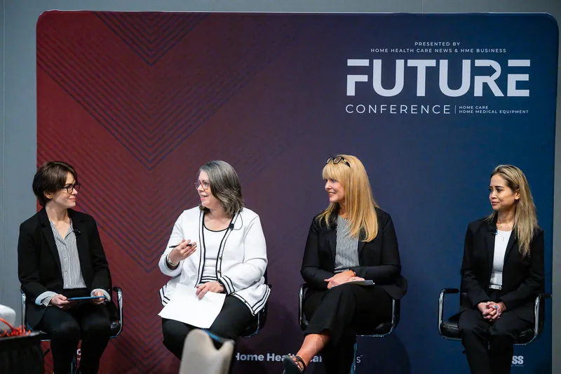 Monica D. Cutia speaking on the FUTURE panel in Austin, black blazer, under the FUTURE Conference banner